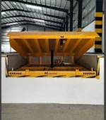 Heavy-duty 12-ton hydraulic dock leveller in action at loading bay